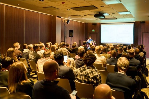 A packed side-track room